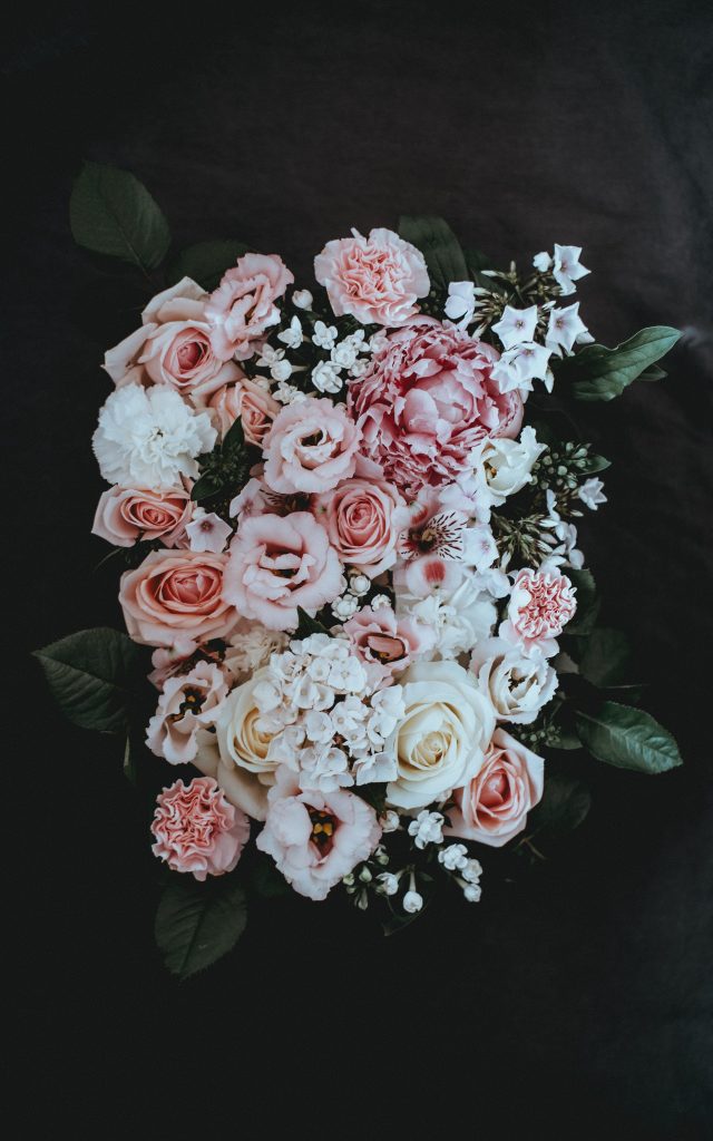 white and pink petaled flower arrangement
